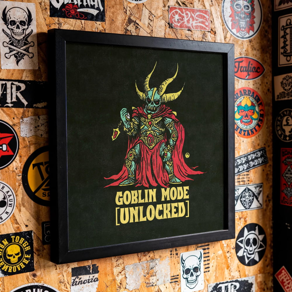 a wall covered in various stickers, patches, and graffiti, with a framed graphic of a green-skinned, horned figure holding a weapon and the text "GOBlin mode (Unlocked)" prominently displayed.