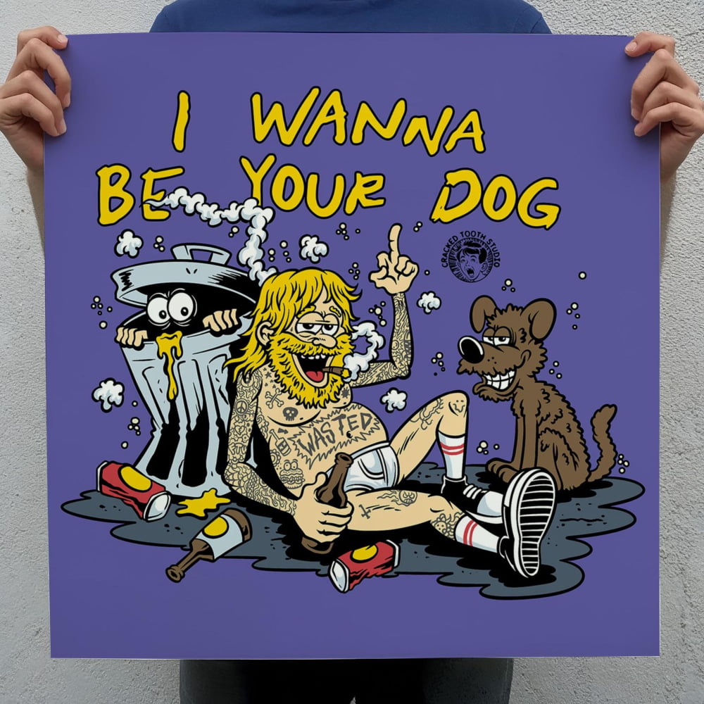 A person is holding up a sign with a cartoon illustration of a man and a dog, along with the text "I WANNA BE YOUR DOG".