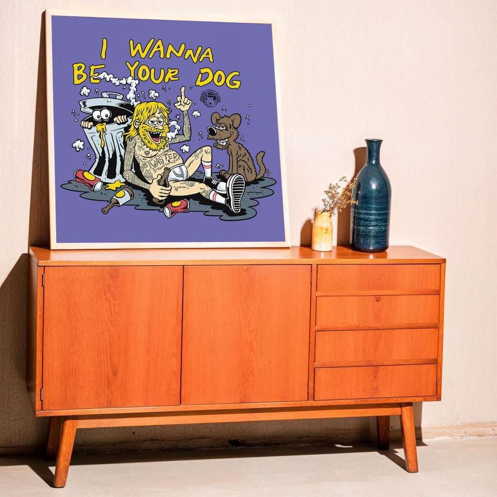 a wooden cabinet with a framed poster of a cartoon character on top of it.