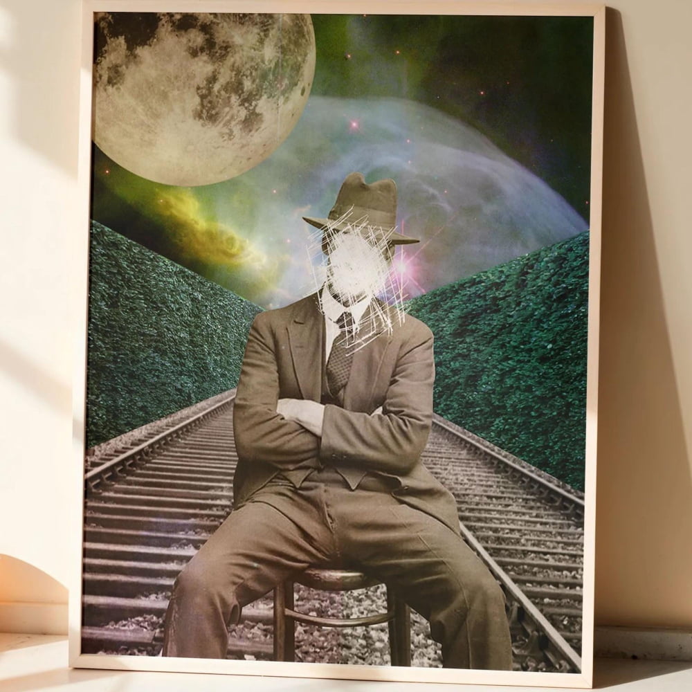 The image is a framed collage depicting a man in a suit sitting on train tracks, with a large moon and a green landscape in the background.