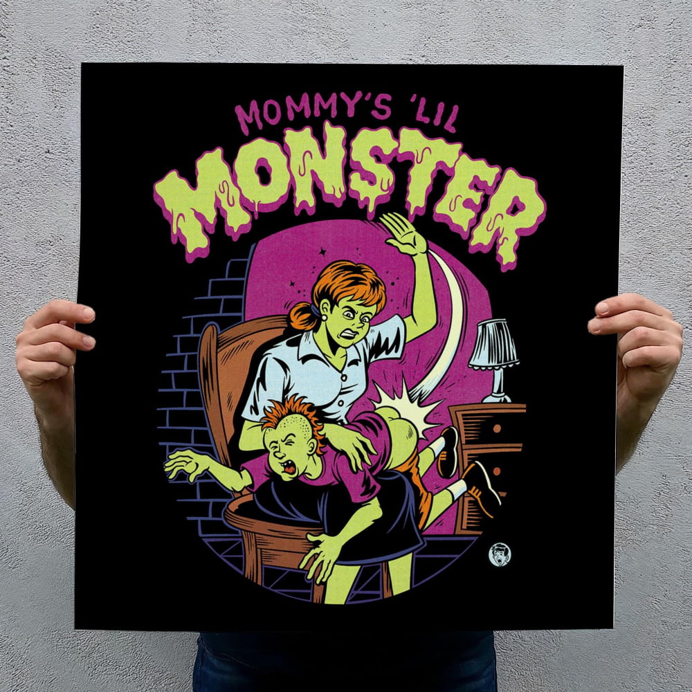 a woman holding a child, with the child appearing to be in distress or fear. The woman is wearing a white shirt and is positioned in front of a dark background. The title "Mommy's 'Lil Monster'" is prominently displayed above the illustration.
