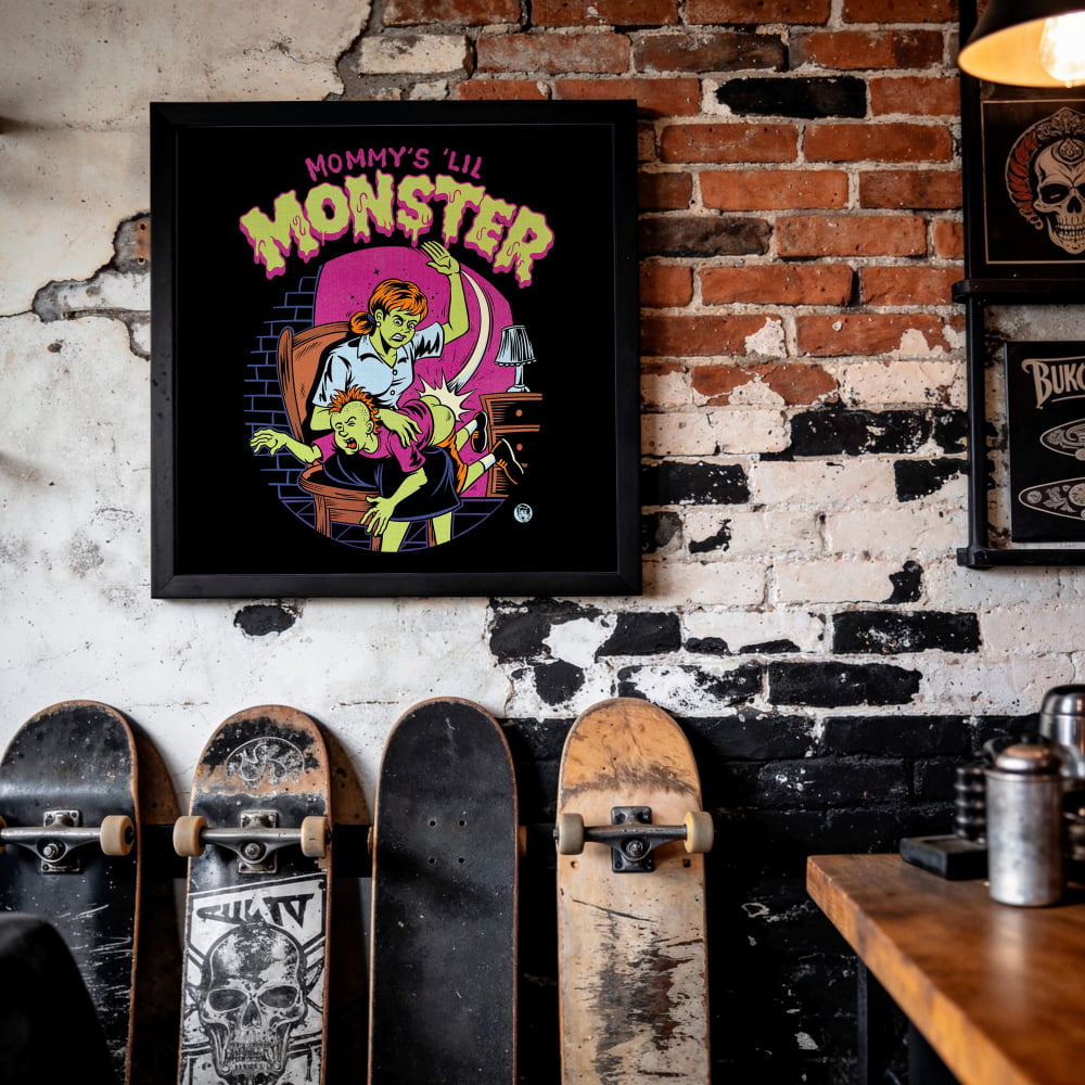 a framed poster of a cartoon monster with a skateboard in the foreground.