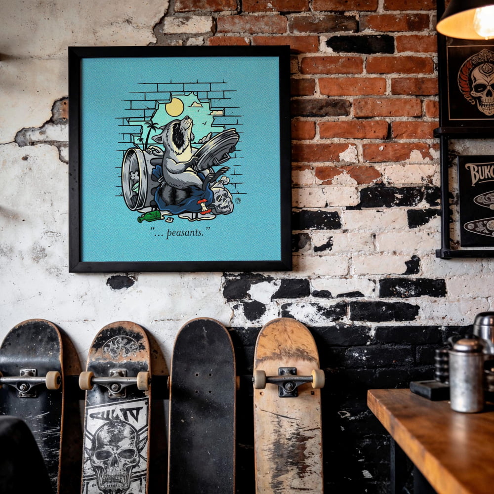 a wall with a framed illustration of a bird, a skull, and a skull-like design, along with the word "present" written below the illustration. There are several skateboards leaning against the wall, including a black skateboard with a skull design and a wooden skateboard.