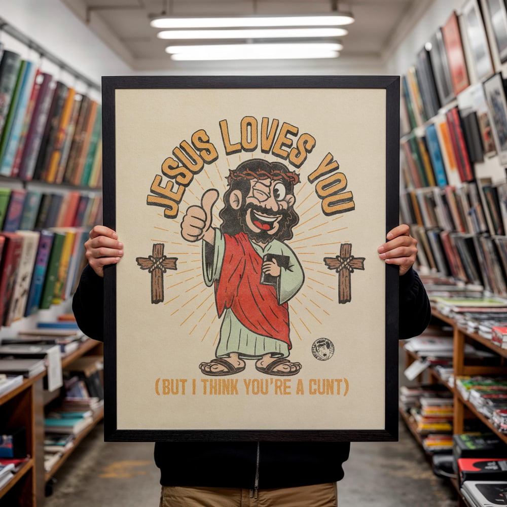 A person is holding up a framed poster with a cartoon image of Jesus and text that says "JESUS LOVES YOU (BUT I THINK YOU'RE A CUNT)"