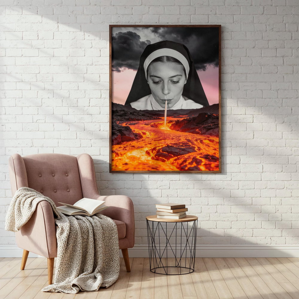 a large framed poster of a nun with a fiery landscape in the background, hanging on a white brick wall.